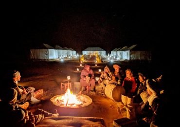 romantic dinner around camp fire
